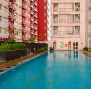 Swimming Pool 5 Cozy Studio at Taman Melati Margonda Apartment By Travelio