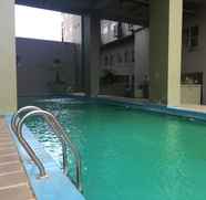 Swimming Pool 3 Comfy and Stylish 2BR at Grand Asia Afrika Apartment By Travelio