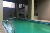 Swimming Pool Comfy and Stylish 2BR at Grand Asia Afrika Apartment By Travelio