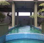 Swimming Pool 4 Comfy and Stylish 2BR at Grand Asia Afrika Apartment By Travelio