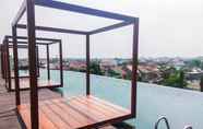 Swimming Pool 2 Comfy 1BR with Modern Style Grand Kamala Lagoon Apartment By Travelio