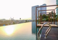 Swimming Pool 3 Comfy 1BR with Modern Style Grand Kamala Lagoon Apartment By Travelio