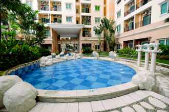 Swimming Pool 4 2BR with Good Location at City Home MOI Apartment By Travelio