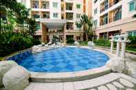 Swimming Pool 2BR with Good Location at City Home MOI Apartment By Travelio