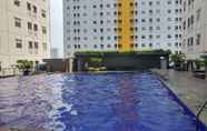 Swimming Pool 3 Trendy 2BR at Green Pramuka Apartment By Travelio