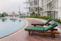 Swimming Pool Fully Furnished Studio at Majestic Point Serpong Apartment By Travelio