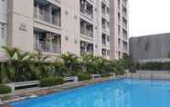 Swimming Pool 5 Modern Design 2BR at Bintaro Park View Apartment By Travelio