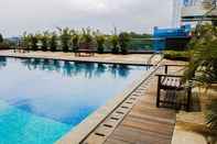 Swimming Pool Beautiful and Comfy 2BR at Tree Park Apartment By Travelio