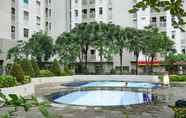 Lobi 4 2BR with Direct Access to Pool at Green Bay Apartment By Travelio