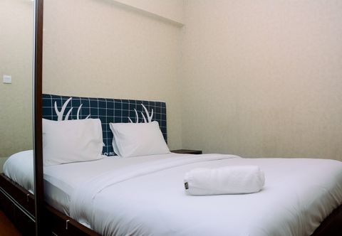 Bedroom 2BR with Direct Access to Pool at Green Bay Apartment By Travelio