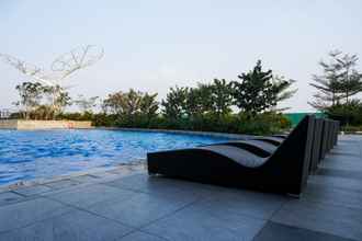 Swimming Pool 4 Elegant Studio with City View at West Vista Apartment By Travelio