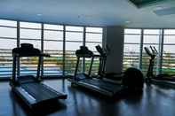 Fitness Center Elegant Studio with City View at West Vista Apartment By Travelio