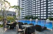 Swimming Pool 2 Elegant Studio with City View at West Vista Apartment By Travelio
