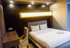 Bedroom 2 Modern and Spacious Studio Apartment at Taman Melati By Travelio