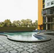 Swimming Pool 4 Cozy Living 2BR at Apartment Pancoran Riverside By Travelio