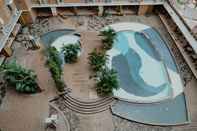 Swimming Pool Compact and Homey 2BR Pluit Sea View Apartment By Travelio