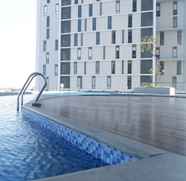 Swimming Pool 2 Premium 2BR at The Linden Apartment near Marvell City Mall By Travelio