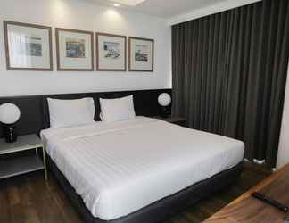 Bedroom 2 Premium 2BR at The Linden Apartment near Marvell City Mall By Travelio