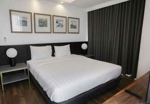 Bedroom Premium 2BR at The Linden Apartment near Marvell City Mall By Travelio