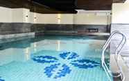 Swimming Pool 6 Homey and Pleasant 2BR Apartment at Tamansari La Grande By Travelio