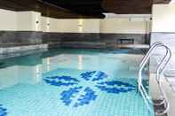 Swimming Pool Homey and Pleasant 2BR Apartment at Tamansari La Grande By Travelio
