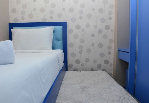 Bedroom Comfy and Spacious 2BR Bassura City Apartment By Travelio