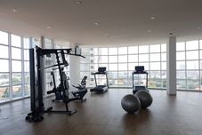 Fitness Center Modern Studio at Tree Park Cikokol Apartment By Travelio