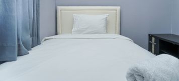Bedroom 2 Modern and Comfy 2BR Seasons City Apartment with City View By Travelio