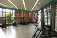 Fitness Center Cozy and Modern 1BR Apartment Amega Crown Residence By Travelio