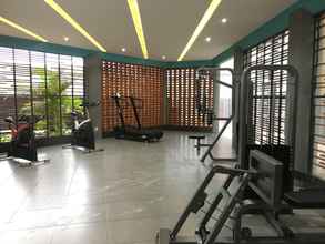 Fitness Center 4 Cozy and Modern 1BR Apartment Amega Crown Residence By Travelio