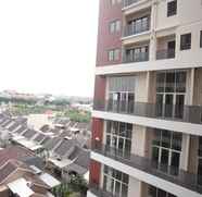 Bangunan 5 Cozy and Modern 1BR Apartment Amega Crown Residence By Travelio