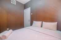 Bedroom Comfort 1BR with Study Room at Green Pramuka Apartment By Travelio