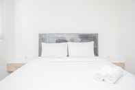 Bedroom Modern and Comfy Studio Bintaro Icon Apartment By Travelio