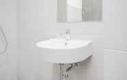 In-room Bathroom 4 Modern and Comfy Studio Bintaro Icon Apartment By Travelio
