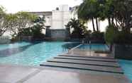 Swimming Pool 4 Elegant 2BR with Working Room at The Lavande Residences Apartment By Travelio