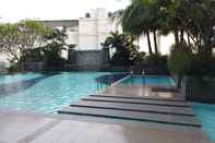 Swimming Pool Elegant 2BR with Working Room at The Lavande Residences Apartment By Travelio