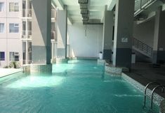 Swimming Pool 5 Simply 1BR Apartment at Stanford Jatinangor By Travelio
