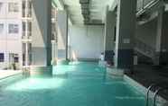 Swimming Pool 5 Simply 1BR Apartment at Stanford Jatinangor By Travelio