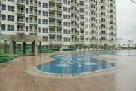 Swimming Pool Homey and New Furnished 3BR Green Sedayu Apartment By Travelio