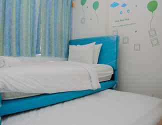 Bedroom 2 Comfort 1BR with Study Room Apartment at Menteng Square By Travelio