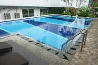 Swimming Pool Comfortable 2BR near Bassura Mall at Bassura City Apartment By Travelio