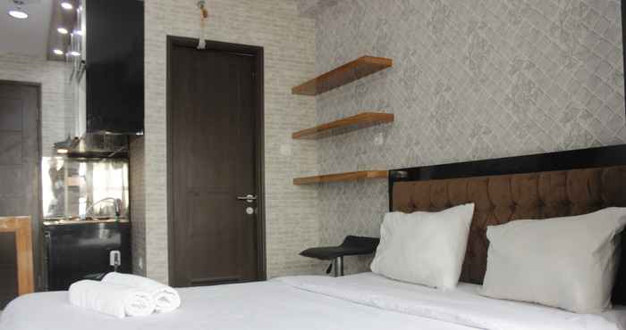 Kamar Tidur Pleasant Studio Room Apartment at Mekarwangi Square Cibaduyut By Travelio