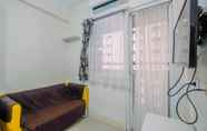 Common Space 4 Relaxing 2BR Apartment at Green Pramuka By Travelio