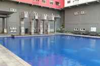 Swimming Pool Relaxing 2BR Apartment at Green Pramuka By Travelio