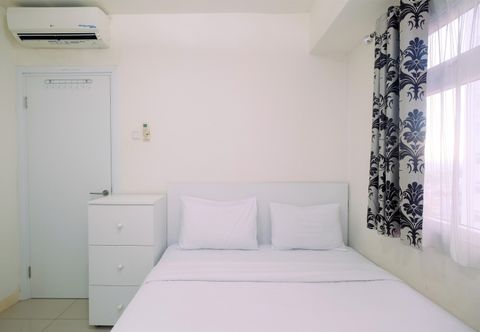 Bedroom Relaxing 2BR Apartment at Green Pramuka By Travelio