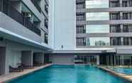 Swimming Pool 7 Modern 1BR Apartment at Ciputra World 2 By Travelio