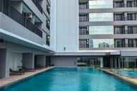 Swimming Pool Modern 1BR Apartment at Ciputra World 2 By Travelio