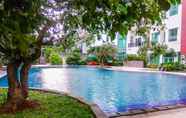 Swimming Pool 6 Fully Furnished with Comfortable Design 1BR Apartment at Woodland Park Residence By Travelio