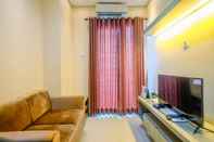 Common Space Fully Furnished with Comfortable Design 1BR Apartment at Woodland Park Residence By Travelio