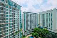 Exterior Fully Furnished with Comfortable Design 1BR Apartment at Woodland Park Residence By Travelio